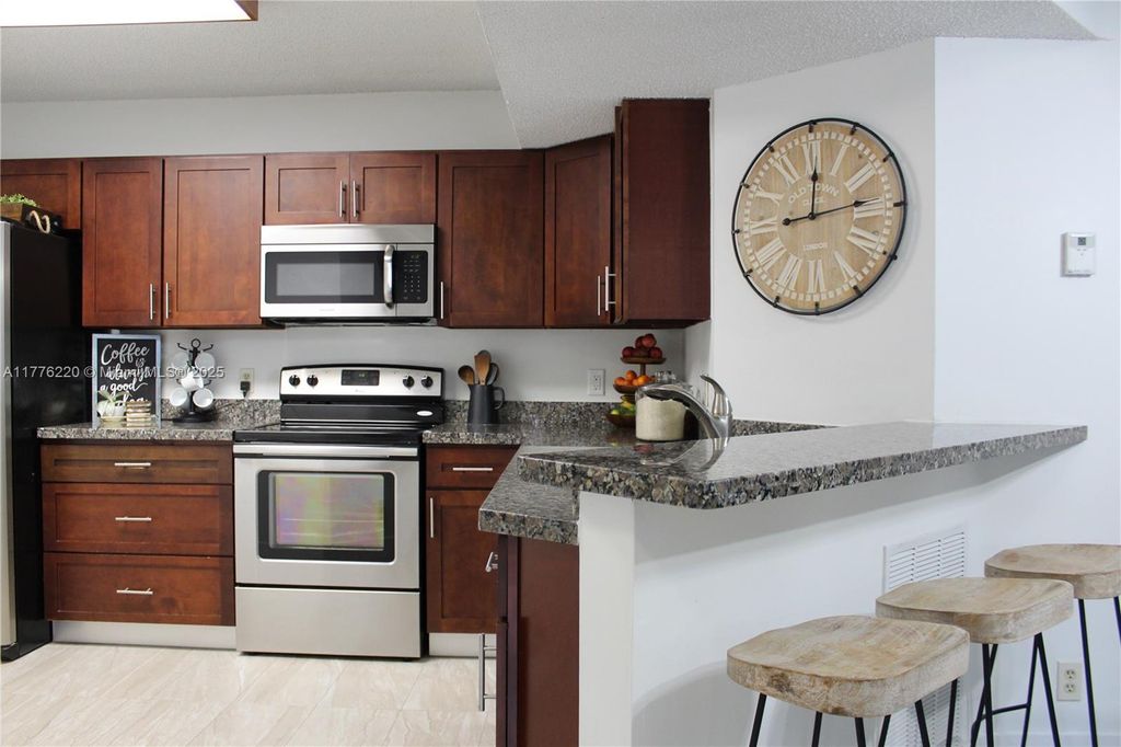 Photo of 8871 Wiles Rd #205, Coral Springs, FL 33067 (MLS # A11776220)