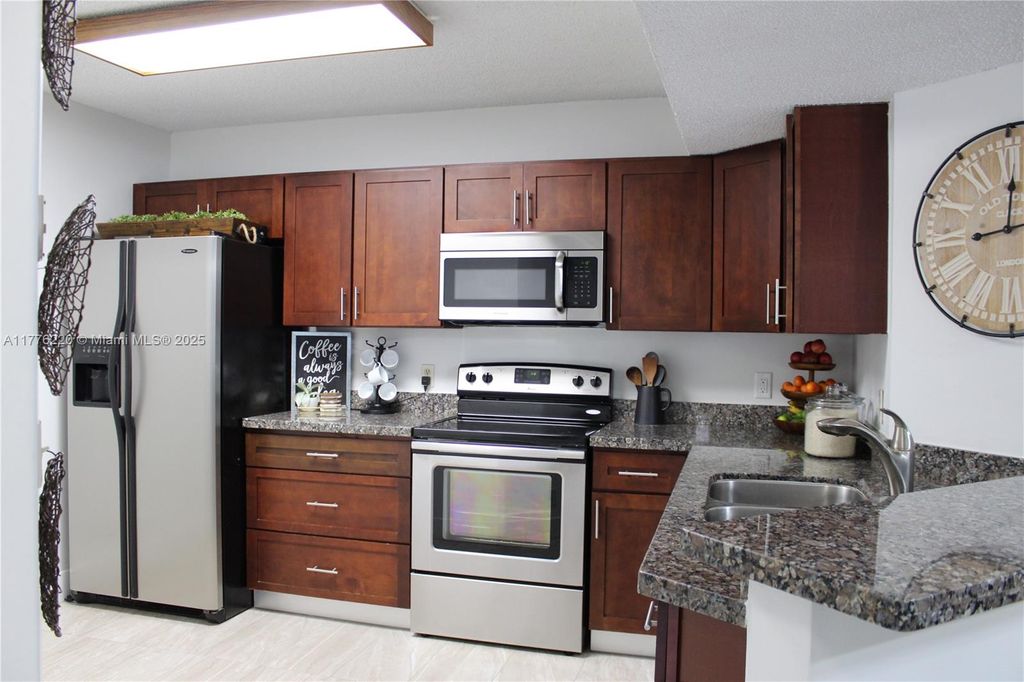 Photo of 8871 Wiles Rd #205, Coral Springs, FL 33067 (MLS # A11776220)