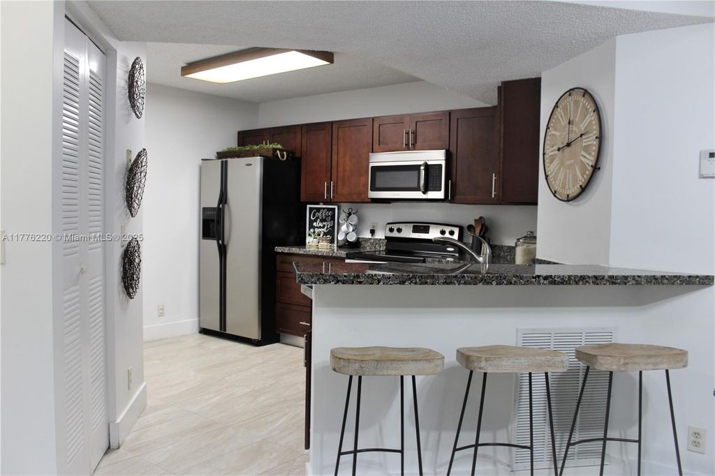 Photo of 8871 Wiles Rd #205, Coral Springs, FL 33067 (MLS # A11776220)