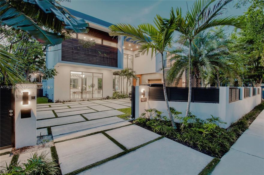 Live Limitlessly in this modern home located in the highly sought-after neighborhood of North Coconut Grove, just a 5-minute drive from Brickell, Key Biscayne's beaches, and Cocowalk's dining and shopping options. The Natoma Manor neighborhood offers a secure and tranquil lifestyle with 24-hour police patrol. Completed in 2022, this home features European porcelain tile, Brazilian wood flooring, custom kitchen cabinetry, and quartz countertops with Onyx inlay. The kitchen is equipped w/ Wolf, Miele, and Subzero appliances, and a gas fireplace adds warmth and ambiance. The home has 6 bedrooms with en-suite bathrooms and built-out walk-in closets. The backyard oasis boasts an outdoor kitchen, dining area, and saltwater pool & jacuzzi, all perfect for entertaining guests or relaxing in style.