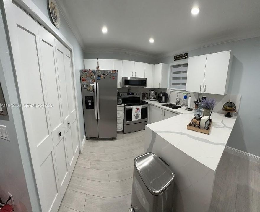 Beautiful 3-bedroom and 2-bathroom condo, featuring: spacious master bedroom with walk-in closet, quartz countertop, stainless steel appliances, in-unit washer/dryer, impact windows with zebra blinds, front door is impact, tile floors throughout and tankless water heater.  Parking space available for 2 cars plus guest parking right in front.  Condo is located close to shopping centers, schools and highways.  Centrally located near an urgent care, supermarkets, pharmacies and the USPS office. *** Tenant Occupied till 1/31/26***