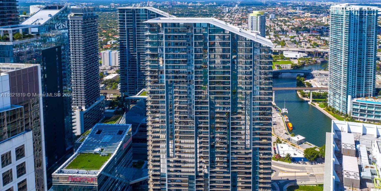 Outstanding and breathtaking views apartment to the City and Miami River. This wonderful unit has 3 bedrooms, 3 bathrooms, 1 half bathroom and a den. Extremely spacious, state of the art appliances, wine fridge, gorgeous and stylish bathrooms, all you need in a closet space, Italian kitchen cabinets, premium appliances, quartz stone kitchen countertops and backsplash, imported floors. Building has resort a-like amenities such as fitness center, onsite personal trainer, children playground, resident café, library, grills, heated pools and spa (poolside services). Best location in the heart of Brickell, neighborhood has everything you need at your fingertips.