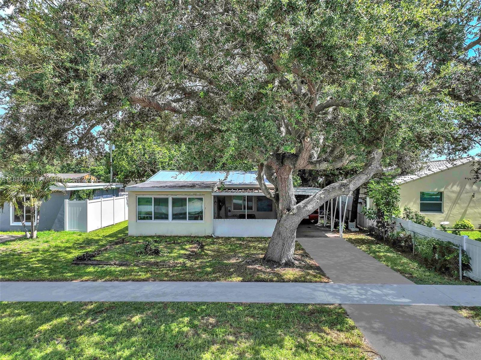 Welcome to this delightful single-family home perfectly situated in one of the most convenient and sought-after areas of South Florida! Located just 10 minutes from the beach, Dania Pointe, Downtown Hollywood, Fort Lauderdale Airport, and I-95, this home offers the ideal blend of comfort and accessibility. Nestled on a generous nearly 7,000 square foot lot, the property features a newer metal roof (2020) and hurricane impact windows and doors for peace of mind and energy efficiency. Inside, you’ll find 2 cozy bedrooms, 1 full bathroom, and a spacious laundry room that adds practicality and storage space. The oversized lot offers endless possibilities—whether you dream of expanding, adding a pool, or creating your perfect backyard oasis. Sunroom/Laundry Room not included in sq footage.