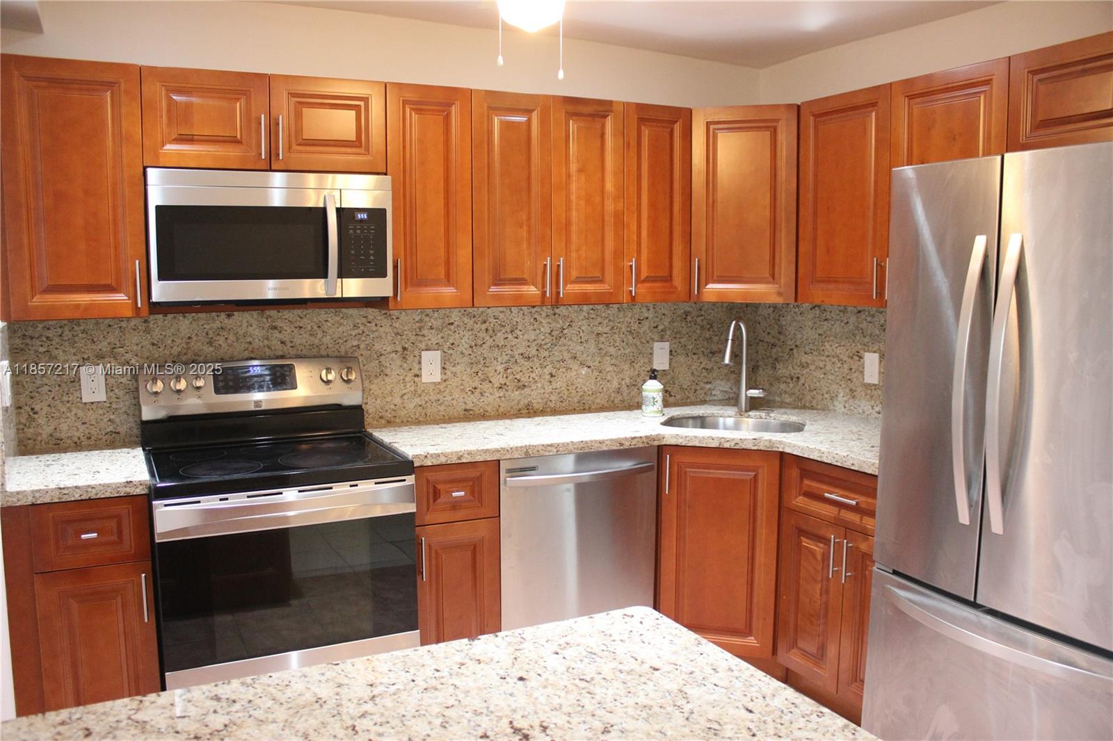 Spacious 2 Bedroom, 2.5 Bathroom townhouse just across the street from the beach! On the first floor there is a large living room, dining room, and kitchen with granite countertops and stainless-steel appliances. There's a storage closet and a 1/2 bath on the 1st floor as well. Tile and wood flooring throughout and high impact windows! On the 2nd floor there are 2 bedrooms and 2 full baths. Your parking space is just outside your door! The Four Seasons Hotel at the Surf Club is just across the street and it's conveniently located near shops, restaurants, and supermarkets!