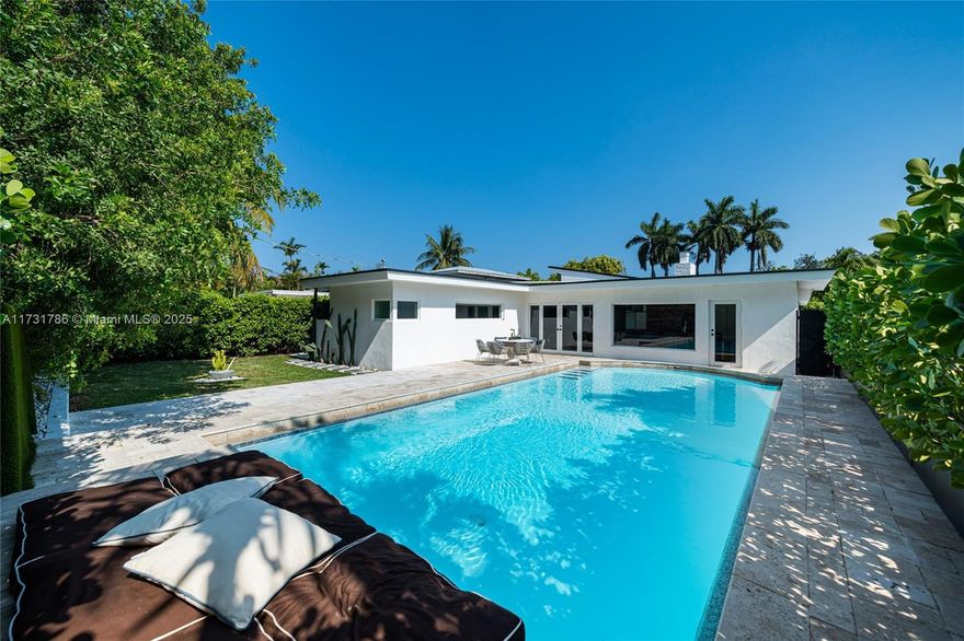 This beautifully remodeled 3-bed, 2-bath home in the Normandy shores gated community has been updated from top to bottom, including a brand-new metal roof, impact windows and doors. Enjoy peaceful golf course views from the bright open space living room with high ceilings, fireplace and a premium chef kitchen with Italian cabinetry. The spacious bedrooms provide a comfortable retreat. Outside, the private backyard boasts a resurfaced pool, ideal for entertaining or relaxing in the Florida sun. With golf and tennis courts nearby, and the beach just minutes away, this home offers both convenience and tranquility—only 20 minutes from downtown Miami and the airport.