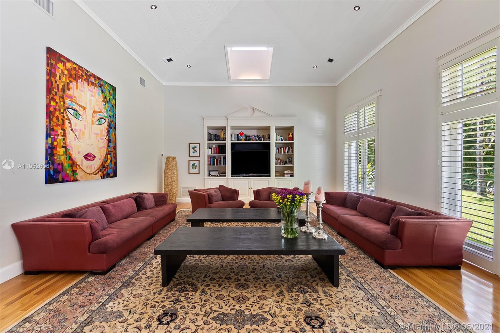Located on a quiet cul-de-sac in Coral Gables near the Ponce-Davis area, this beautiful home is filled with natural light and understated elegance. The 5b/6b main house encompasses 8,000+sf and features formal living and dining rooms, spacious family room with high vaulted ceilings, customs built-ins, skylights, renovated kitchen with high-end appliances, impact windows and doors and oak flooring. Separate and newer 3b/2b guesthouse with kitchen is ideal for in-laws, grown children or staff. Outdoors the 38,000+sf lot is an oasis with palms, fruit trees and orchids incorporated throughout serving as the backdrop for a lavish pool surrounded by a stone patio perfect for family gatherings and entertaining. A three car garage and whole house generator complete this incredible offering.