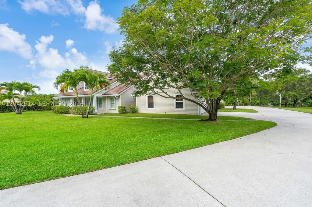 Photo of 5703 Lago Del Sol Dr, Lake Worth, FL 33449 (MLS # A12042514)