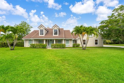 Photo of 5703 Lago Del Sol Dr, Lake Worth, FL 33449 (MLS # A12042514)