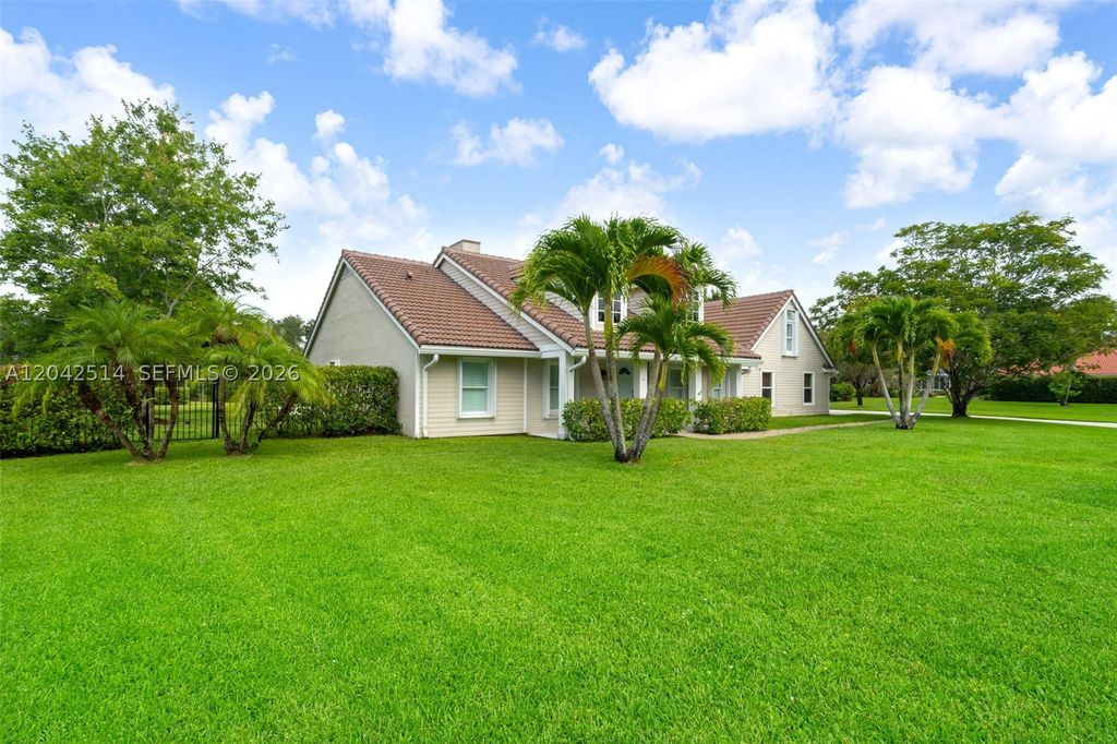 Photo of 5703 Lago Del Sol Dr, Lake Worth, FL 33449 (MLS # A12042514)