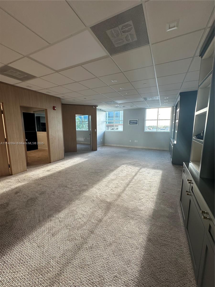 Large unit completely remodeled with wood paneling. Three offices with lots of light and windows. A large open working space. There is a kitchen. Vault door, safe in on of the office. Camera security and unit with a sophisticated security system. Partially furnished. Crema marfill marble floor below carpet.
Two assigned parking and numerous guest parking. Hallways newly renovated. Brand new modern elevators and building completely painted a year ago.
On Site management.