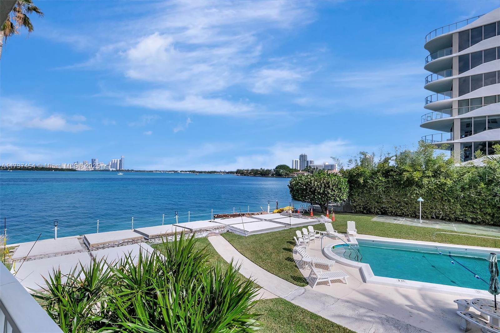 Serene Waterfront Retreat for Discerning Adults!!
Perfect for snowbirds seeking worry-free living! This tranquil 2-bed, 2-bath co-op offers stunning water views in an intimate, quiet community of established residents. Second-floor prime location with 750+ sq ft, terrazzo floors, central A/C. Enjoy heated bayfront pool, dock access, BBQ area, and beautifully maintained grounds ensuring peaceful living. Steps to Bal Harbour Shops and beach. Assigned parking, on-site laundry. Comes fully furnished - move-in ready! 33-year land lease offers cost-effective luxury living. Cash purchase, owner-occupied only. Motivated seller welcomes your offer! Ideal lock-and-leave seasonal or year-round retreat. Call for private showing!