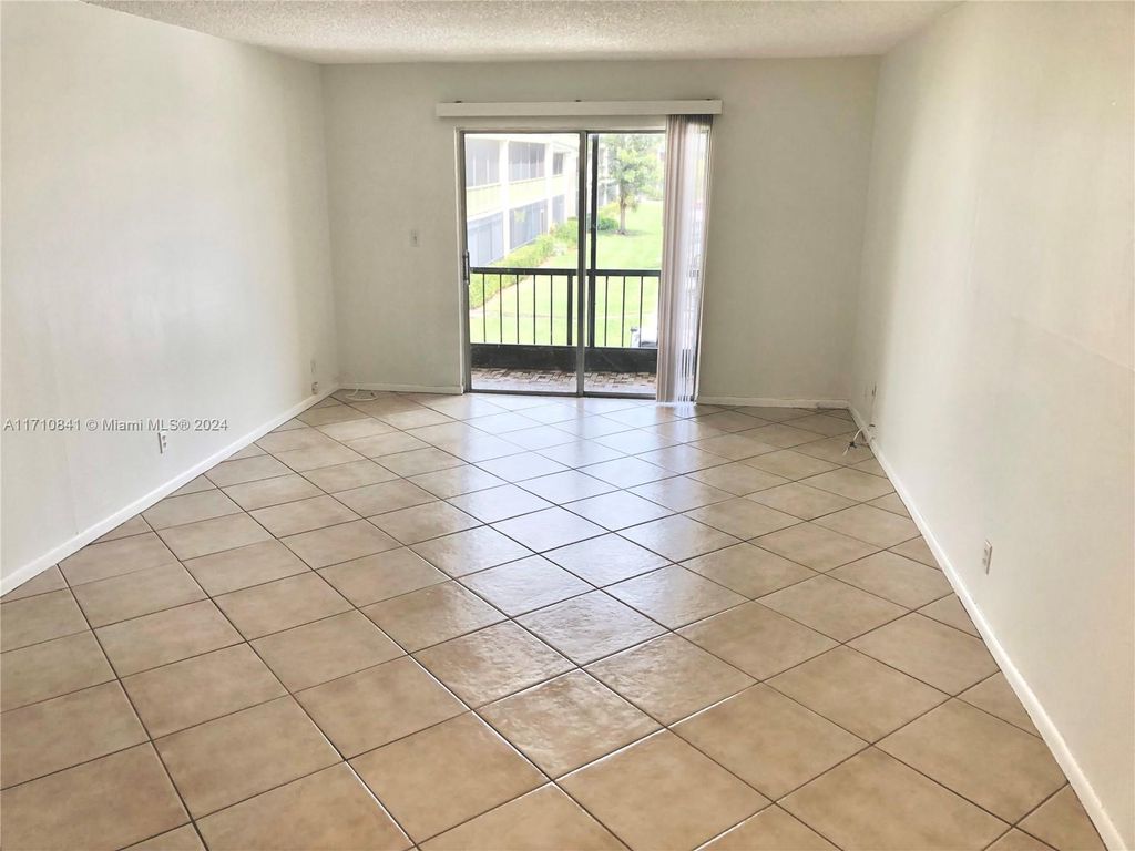 Photo of 4118 NW 88th Ave #207, Coral Springs, FL 33065 (MLS # A11710841)
