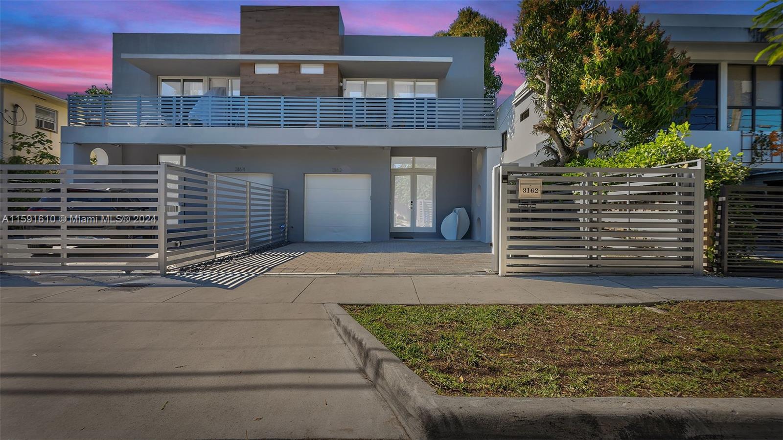 Rare find in the Heart of the Grove! Stunning modern design 4 bedroom, 4 bath gated townhome with top of the line finishes. The open concept design integrates living spaces with the kitchen as its centerpiece with center island, high end appliances, and wonderfully designed for entertaining. All bedrooms are en-suite and located upstairs. The primary suite enjoys a spa like bath and private balcony. Impact glass throughout. Covered terrace with built in BBQ and pool. One car garage.