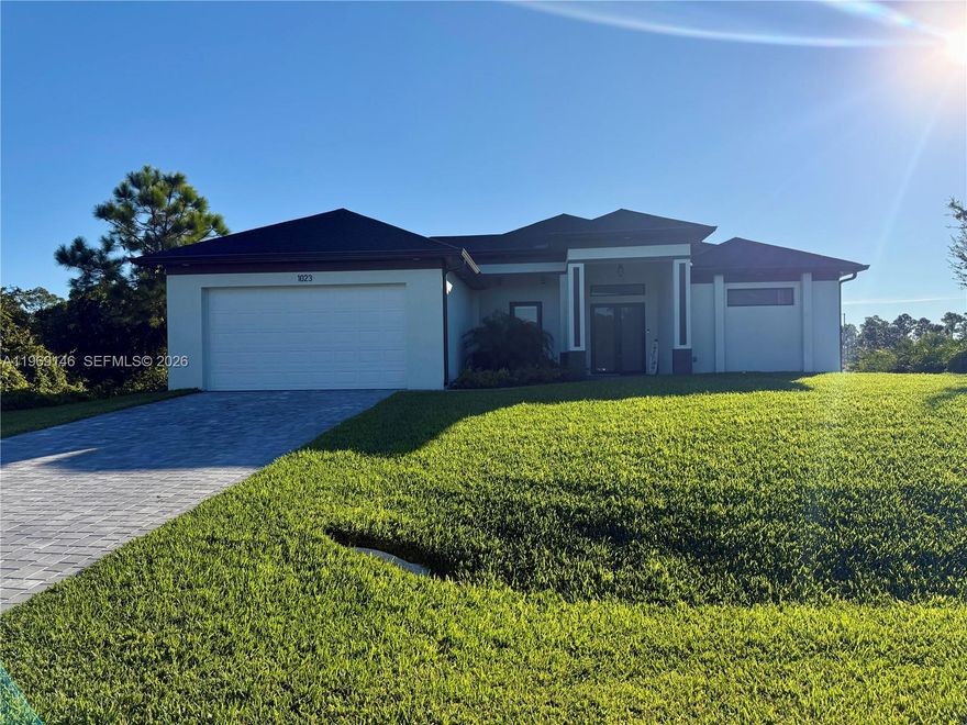 Motivated Seller! Beautiful new construction home located in a growing area of Lehigh Acres, just minutes from SR 82 and Columbus Blvd for easy access to Fort Myers, shopping, and dining. This modern home offers tile flooring throughout, creating a clean and elegant look in every room. The spacious open-concept floor plan features a bright kitchen, perfect for entertaining and everyday living. Enjoy peace of mind with security cameras already installed, adding convenience and safety to your new home. Quality finishes, modern design, and attention to detail make this property move-in ready. Don’t miss this opportunity to own a brand-new home in a prime Lehigh Acres location!
