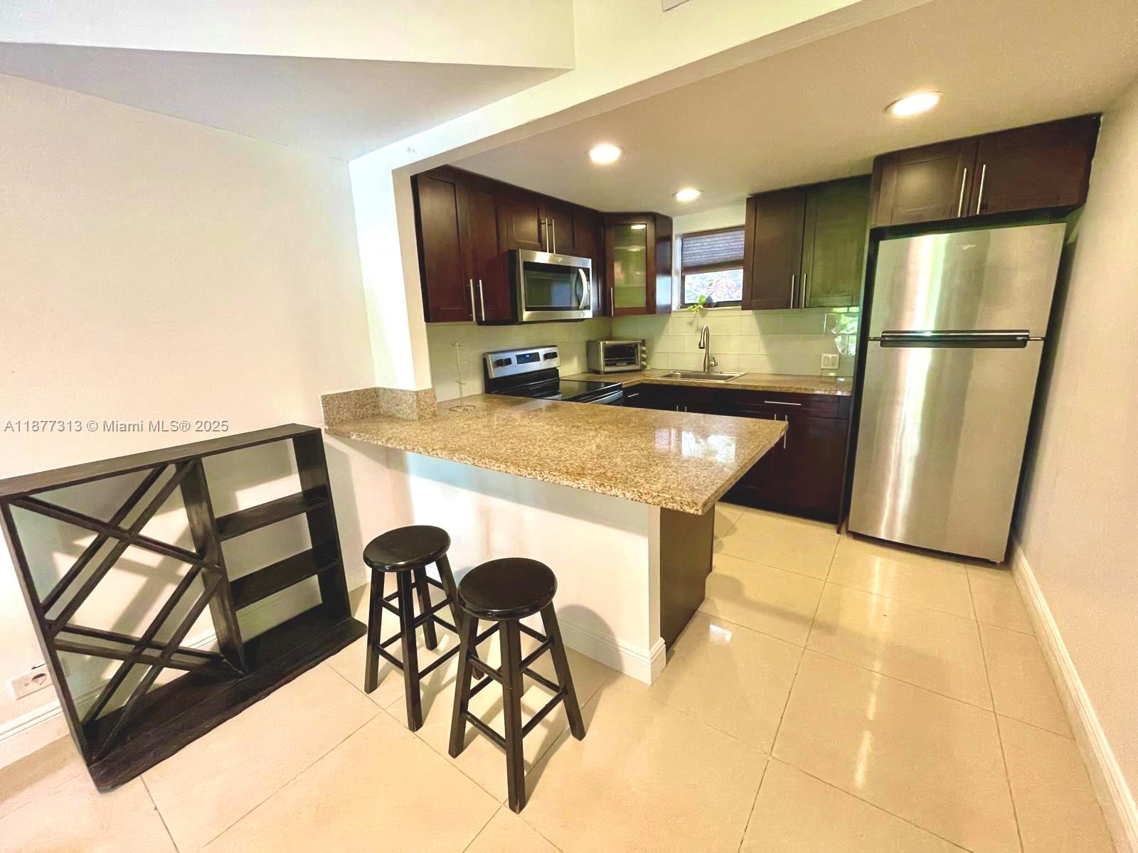 This fully remodeled GROUND floor 1-bedroom, 1-bathroom apartment offering 710 sq. ft. in the heart of Doral is a must-see! This stylish unit features a bright, open layout, an updated kitchen and bathroom, and the convenience of an in-unit washer and dryer. Enjoy your mornings or unwind in the evenings in the back balcony facing one of the many community’s swimming pools, while being just steps away from the community’s gym, mailboxes, and amenities. Las Vistas at Doral is a sought-after gated community with swimming pools, tennis courts, fitness center, clubhouse, and 24-hour security. Perfectly located near major highways, shopping, dining, Downtown Doral and Miami International Airport, this apartment is ideal for both homeowners and investors.