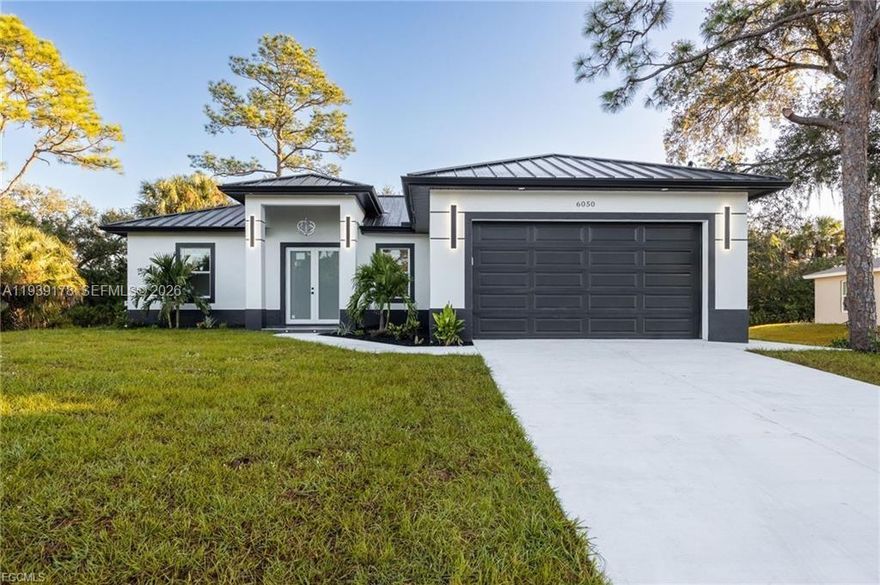 Welcome to your dream home in LaBelle! This stunning New single-family home boasts 3 bedrooms, 2 bathrooms, and a 2-car garage, providing ample space for you and your family. The interior features granite counters, stainless steel appliances, and tile flooring throughout, creating a modern and luxurious feel. The open floor concept allows for seamless flow between the kitchen, living, and dining areas, perfect for entertaining guests or spending quality time with loved ones. The French Doors entrance and tray ceiling add an elegant touch to the space, while the modern bathroom and dining accent wall add a pop of style. Step outside to your own outdoor kitchen with a built-in grill, perfect for hosting summer barbecues or enjoying a quiet evening under the stars. The built-in entertainment system is ideal for movie nights or watching the big game with friends. And with a durable metal roof, you can rest easy knowing your home is built to last. Don't miss out on this incredible opportunity to own a beautiful and functional home in LaBelle. Schedule a showing today and make this your forever home!