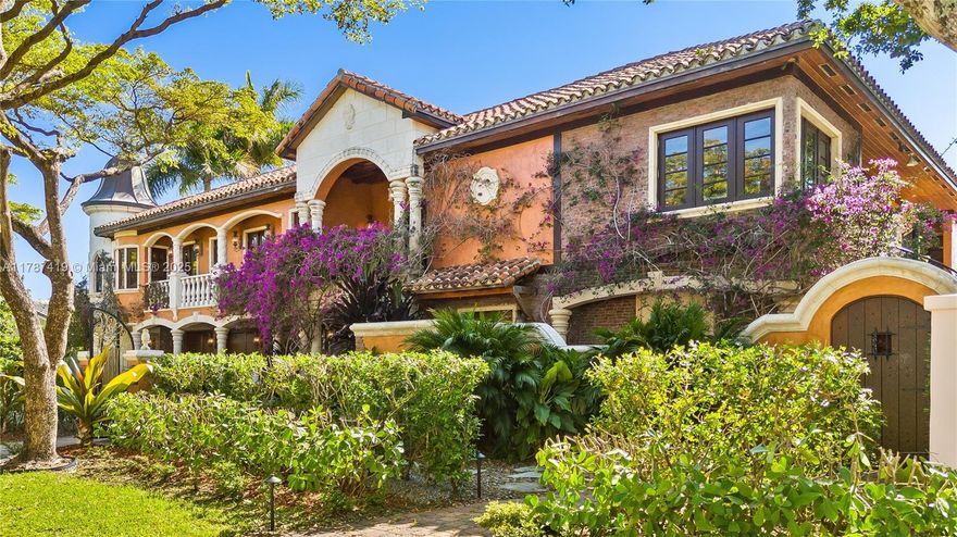 Nestled in an exclusive gated enclave, this 2-story Mediterranean masterpiece offers protected deep-water frontage with 70’ private dock. The lush, tree-canopied courtyard sets the tone with Tuscan-inspired design. Stepping into the foyer, a handcrafted Brazilian wood staircase paired with rich mahogany millwork highlights exquisite, timeless craftsmanship. First floor features state-of-the-art theatre, private wine cellar, ensuite primary, spacious den. Second-level boasts, chef’s kitchen with premium appliances flowing seamlessly into a formal dining room and conversational fireplace, gracefully complemented by an ornate elevator. Master Bedroom with expansive closets & spa-inspired shower. Rare exceptional second-level pool, an expression of luxury, artistry, and Mediterranean elegance.