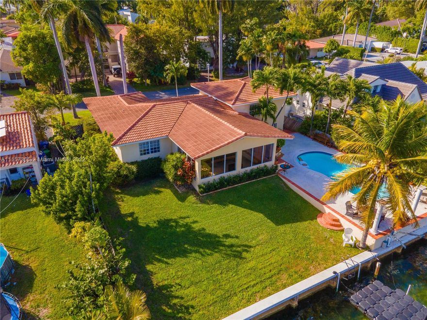 Spacious 3 Bed/3.5 Bath Elevated Waterfront Home Located in the Highly Coveted and Gated North Bay Island. Situated on an Oversized Lot, This Property Features a 2 Car Garage with Driveway Space for 4 More, Massive Backyard with Pool Overlooking Biscayne Bay and Miami Beach. 80 Ft of Waterfrontage Perfect for Boat Parking. Interior Features Marble and Laminate Flooring Throughout. First Floor Features 2 Bedrooms/2 Bathrooms and Florida Room Perfect for Entertaining Family and Friends with an Indoor/Outdoor Aspect. Owners Suite Located Upstairs with Large Bathroom and Roomy Closets. Location Offers Easy Access to All Major Roadways, Shopping, Schools, Public Parks, Public Transportation, Dining, and So Much More!