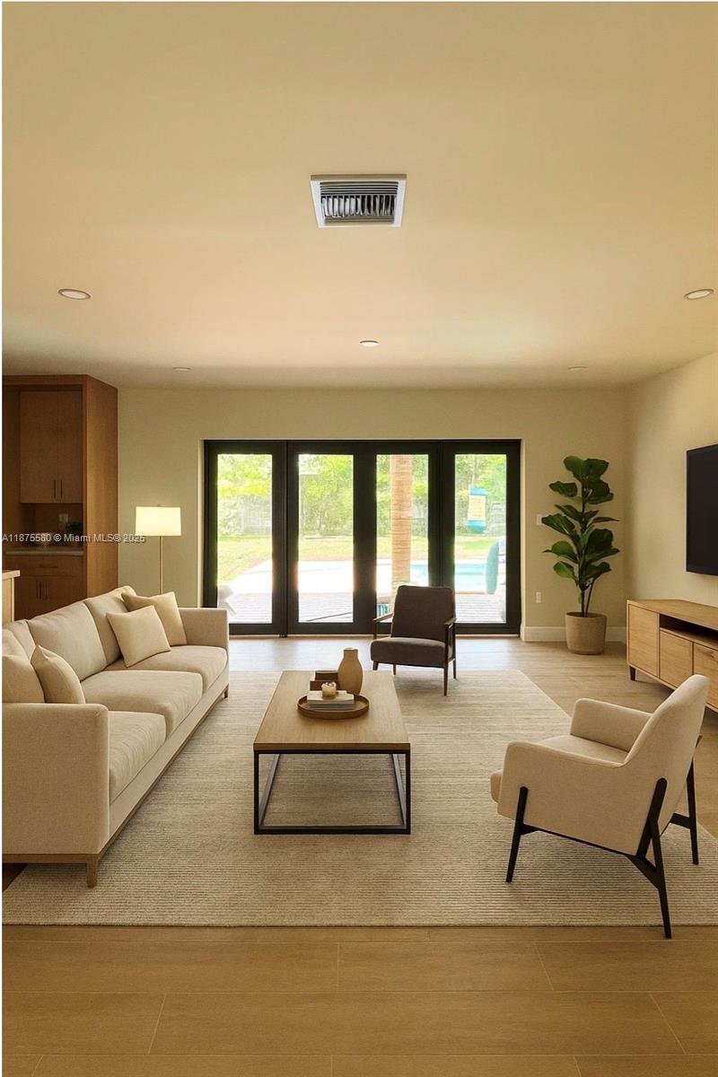 Spacious Pinecrest rental with wood tile floors, modern kitchen with new appliances, and abundant storage. Flexible layout: foyer entry, formal dining and living areas, large den that doubles as an office or extra bedroom, and spacious laundry area. The garage is air conditioned, ideal for storage, studio, or gym. Filled with natural light, each bedroom is generously sized, with updated bathrooms in a modern Spanish design. Plantation shutters throughout, new impact doors and windows, and expansive outdoor living with a large pool, big backyard, avocado and mamey trees. Ample parking. Prime Pinecrest neighborhood with tree-lined streets, private police, and shops and dining nearby.