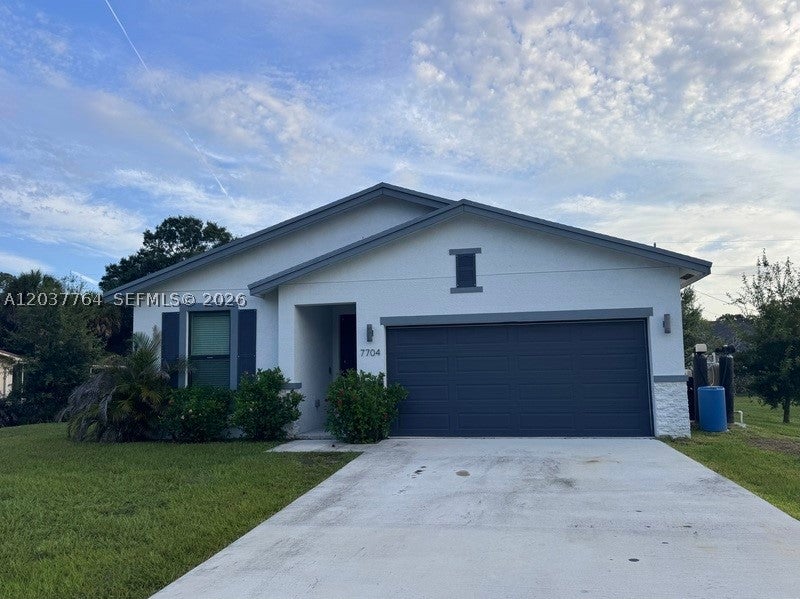 Photo of 7704 Pacific Ave, Fort Pierce, FL 34951 (MLS # A12037764)