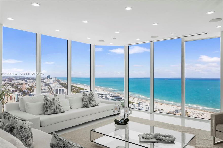 South Beach sky mansion commanding the entire private 34th floor, offering 4,723 SF (5,352 total) of refined living with exceptional privacy and breathtaking 270° panoramic views. Floor-to-ceiling glass walls showcase sweeping vistas of the ocean, bay, skyline, and park, extending seamlessly to four expansive terraces. A private elevator opens to beautifully reimagined interiors, where a grand open-concept living space flows into a bespoke Bulthaup chef’s kitchen with a sculptural waterfall island, custom cabinetry, and top-tier appliances. The residence features two luxurious primary suites, spa-inspired bathrooms, and no shared walls, creating a true sense of exclusivity. Residents enjoy Portofino’s $60M transformation, including a redesigned lobby, resort-style pools, spa, tennis courts, and fitness center. Ideally located in South of Fifth, moments from the beach and top dining. Recently renovated and furnished, this is a rare offering of scale, sophistication, and prestige.