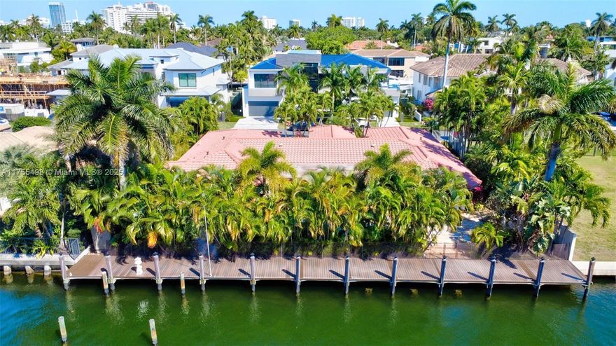 Experience the epitome of waterfront luxury in the prestigious Las Olas Isles! This stunning Mediterranean-style residence boasts 110 feet of deep-water frontage on a wide canal, just two lots from the point, offering very close access to open water. The split floor plan provides a perfect blend of comfort and privacy, while lush tropical landscaping surrounds the property, creating a private oasis. Enjoy a newly built dock (2023), ideal for boating enthusiasts, and a sun-drenched pool area that captures abundant afternoon light. A rare opportunity to own a serene yet centrally located retreat in one of Fort Lauderdale’s most sought-after neighborhoods!