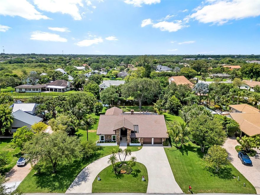 Welcome to Laurel Oaks, a charming community of just 61 homes, each set on nearly one acre of land. Unwind in your waterfront backyard with a firepit, saltwater pool, barbeque and wood-fired pizza oven. Step inside to vaulted ceilings, porcelain tile floors, and a light color palette that creates an open atmosphere. This home features two private suites, ideal for multi-generational living or in-laws. Recent upgrades and features include: Spanish tile roof replaced in 2017; two A/C systems installed in 2018; hybrid water heater replaced in 2017; whole-home water filtration system installed in 2021; all windows and doors are high-impact; fully solar-powered, resulting in very low electric bills; equipped with an EV charging station; freshly painted exterior for a clean, modern look.