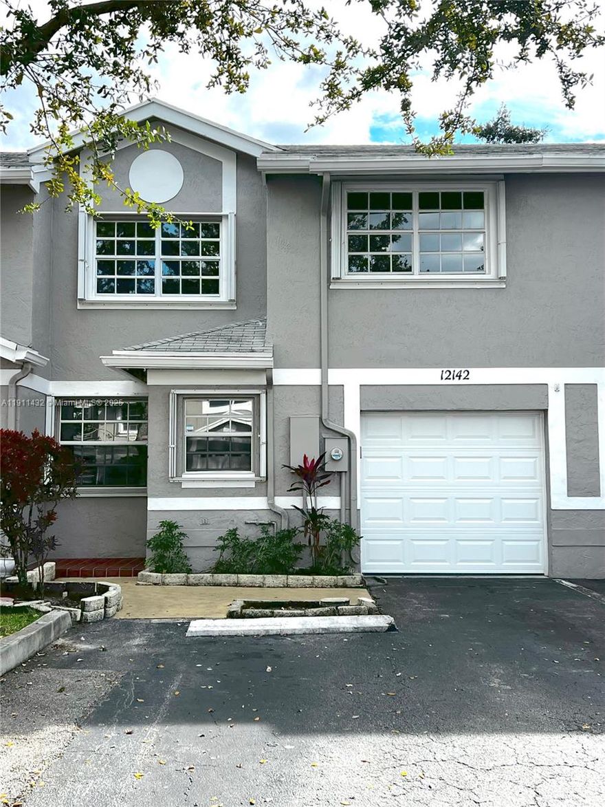 Beautiful 3/2/1 townhome with attached garage in highly desirable Flamingo Gardens, Cooper City. Spacious layout, 1,668 sq ft with brand-new, unused stainless-steel fridge, range, and dishwasher, plus washer & dryer in garage. All bedrooms feature ceiling fans with remotes and generous closet space. Accordion shutters on every window provide easy storm protection. Kitchen includes granite countertops and ample storage. Enjoy a private patio for entertaining and easy access to community amenities: pool, well-kept playground, dog park, tennis, volleyball, & basketball courts. HOA allows immediate leasing, no approval to move in, and corporate ownership OK. Truly investor-friendly! Rare opportunity! Rarely available in this sought-after area. Come see it today!