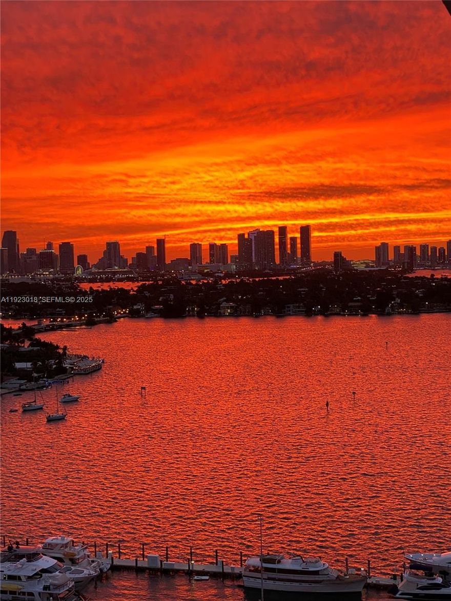 High floor SE corner 2 bedroom and 2 bathroom unit with 2 balconies in the highly desired, walkable Sunset Harbour neighborhood, adjacent to the new Maurice Gibb Park. The views make this unit a must see - incredible sunrises over the ocean AND sunsets over the bay and downtown. Recently updated including new impact windows and doors. Large jacuzzi tub.  In-unit washer and dryer. Tons of natural light. Full-service pet-friendly building with 7th floor bayside pool, hot tub, gym, plus access to the Sunset Harbour Yacht Club pool - perfect for swimming laps.