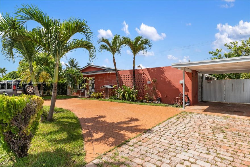 Renovated 3-Bedroom, 2-Bath Single Family Home. Step into modern comfort with this beautifully updated home featuring elegant porcelain tile flooring throughout, wood cabinetry with granite countertops, and stylishly renovated bathrooms. Enjoy peace of mind and potential insurance savings with brand-new impact windows and a durable new metal roof. The property also boasts a spacious covered and insulated patio—perfect for entertaining family and friends year-round. Additional perks include a carport, side parking, and a functional layout designed for everyday living. Conveniently located just minutes from top-rated schools, shopping, and dining, with easy access to the Florida Turnpike and only 5 minutes from Hard Rock Stadium, this home offers both comfort and connectivity. Easy to Show!