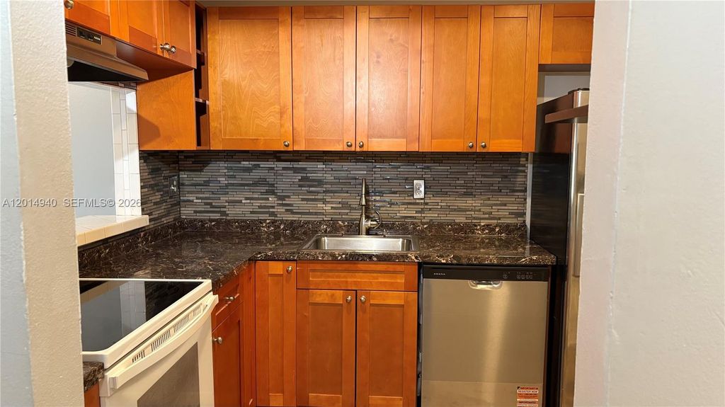 Photo of 4334 NW 9th Ave #7-2F, Deerfield Beach, FL 33064 (MLS # A12014940)