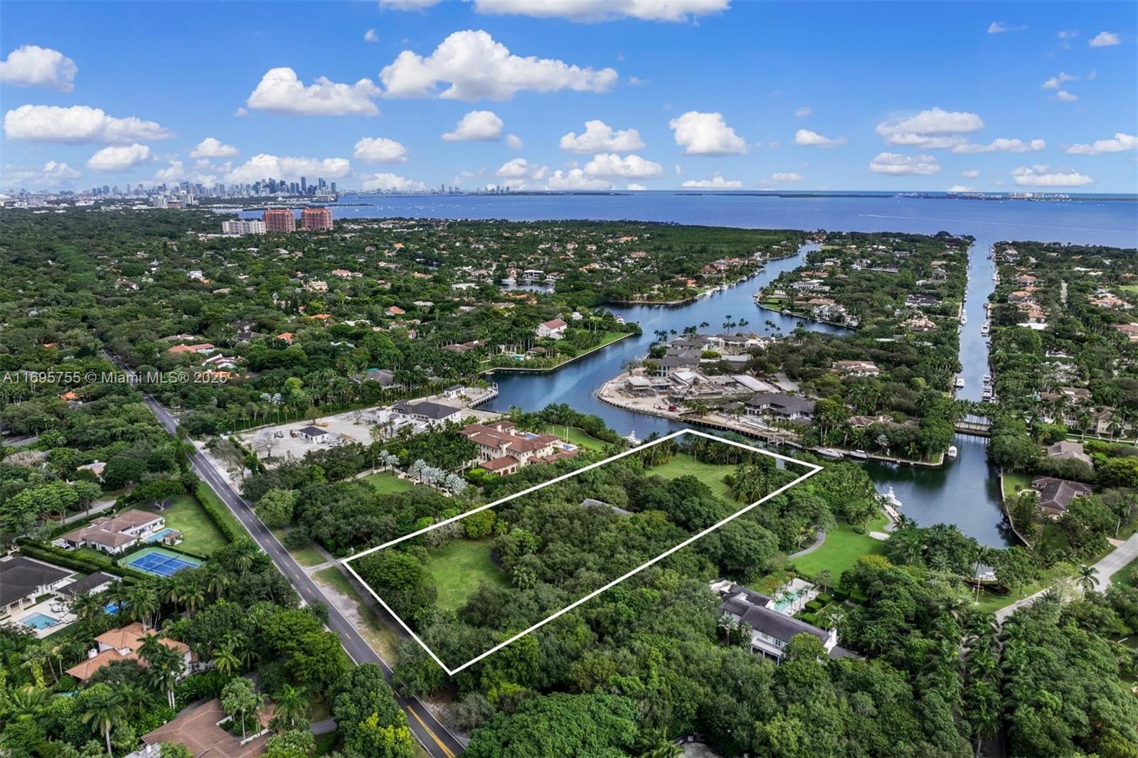 A rare chance to own the second largest parcel in Gables Estates, Coral Gables’ most prestigious community. This spectacular 4.6-acre property, lined with mature trees, features 300 feet of direct water frontage with no bridges to the bay—perfect for yachting enthusiasts. The existing 9,138 SF residence includes 6 bedrooms, 6 bathrooms, and a 1-bedroom guest house, offering endless potential to renovate or build your dream home. Located in the heart of Coral Gables, this estate combines unmatched privacy, prime location, and top-tier security. Gables Estates is synonymous with exclusivity and luxury, offering a lifestyle tailored for those who appreciate it. Opportunities like this are exceedingly rare—claim your place in one of South Florida’s most iconic neighborhoods.