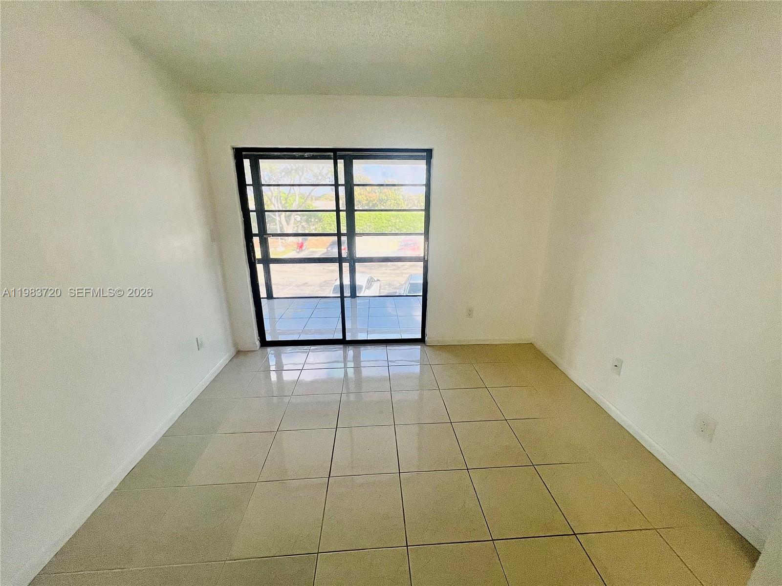 TAMARAC GARDENS CONDOMINI - Residential Lease