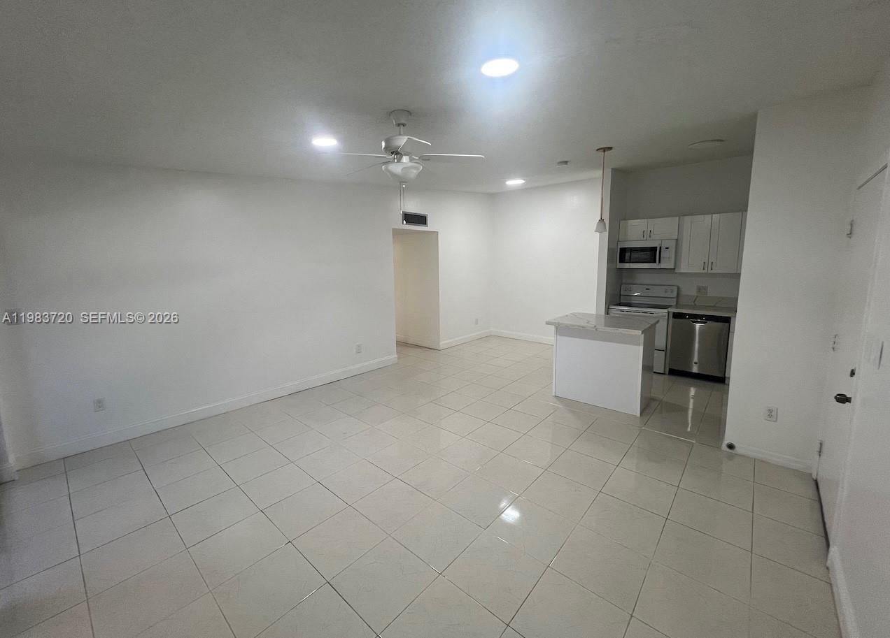 TAMARAC GARDENS CONDOMINI - Residential Lease