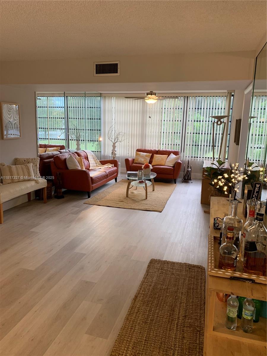 Beautiful Corner unit apartment!! Very Private and quiet, Spectacular views of Golf Course and Lake!!! Totally Remodeled and Fully Furnished !!. 1385 sq/ft, 2 bedrooms, 2 bathrooms with an additional room that can be used as office, den or guest room. Modern kitchen cabinets with granite countertops, SS appliances, Full size Washer and Dryer, Ceiling fans. Enjoy Resort like living with included membership to Pine Island Ridge Country Club which offers Golf, Pool, Tennis courts, 2 Restaurants, Exercise Room, Yoga, Playground and many activities. Great Location, Close to highways, 595, Turnpike, I-75, Restaurants, Shopping, Airport, Schools, Nova Southeastern University, Broward College, etc. Water and Basic cable included. No Pets and No Smoking.