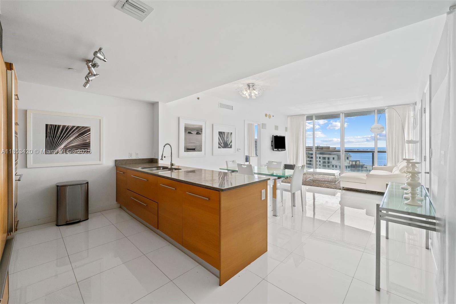 Vacant and easy to show! Clear Bay and Ocean views- option to rent Fully furnished or Unfurnished 2 bed + DEN and 2 full bathrooms with Italian white porcelain tile, open kitchen stainless steel appliances, floor to ceiling impact windows. Main bedroom with 2 walk in closets. Building has two 5 star restaurants, state of the art Spa, Infinity pool, Valet parking, Security, Gym, Theater and unparalleled amenities across Brickell City Center and just two blocks from Whole Foods.