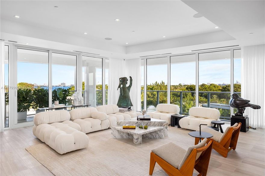 Welcome to the art of home at Ritz-Carlton Residences! Water views from all 3 beds + den & 3.5 baths across 3,418 SF + 3 terraces. Private elevator foyer into open floorplan. Kitchen features Gaggenau appliances, marble countertops, gas cooktop, & double Sub-Zero wine refrigerator. Floor-to-ceiling glass on this corner residence bathe living area w/ natural light & stunning views. The primary suite, w/ private waterfront terrace, features warm wood floors, sitting area, & a fully custom bath w/ marble walls, oversized soaking tub, glass-enclosed shower, & dual vanity w/ marble wall. Guest bedrooms include en-suite bathrooms & sliding glass doors leading to waterfront bliss. Unique only to #621 are twin 2-car climate-controlled garages, 2 addt’l parking spaces, & a 40 FT boat slip.