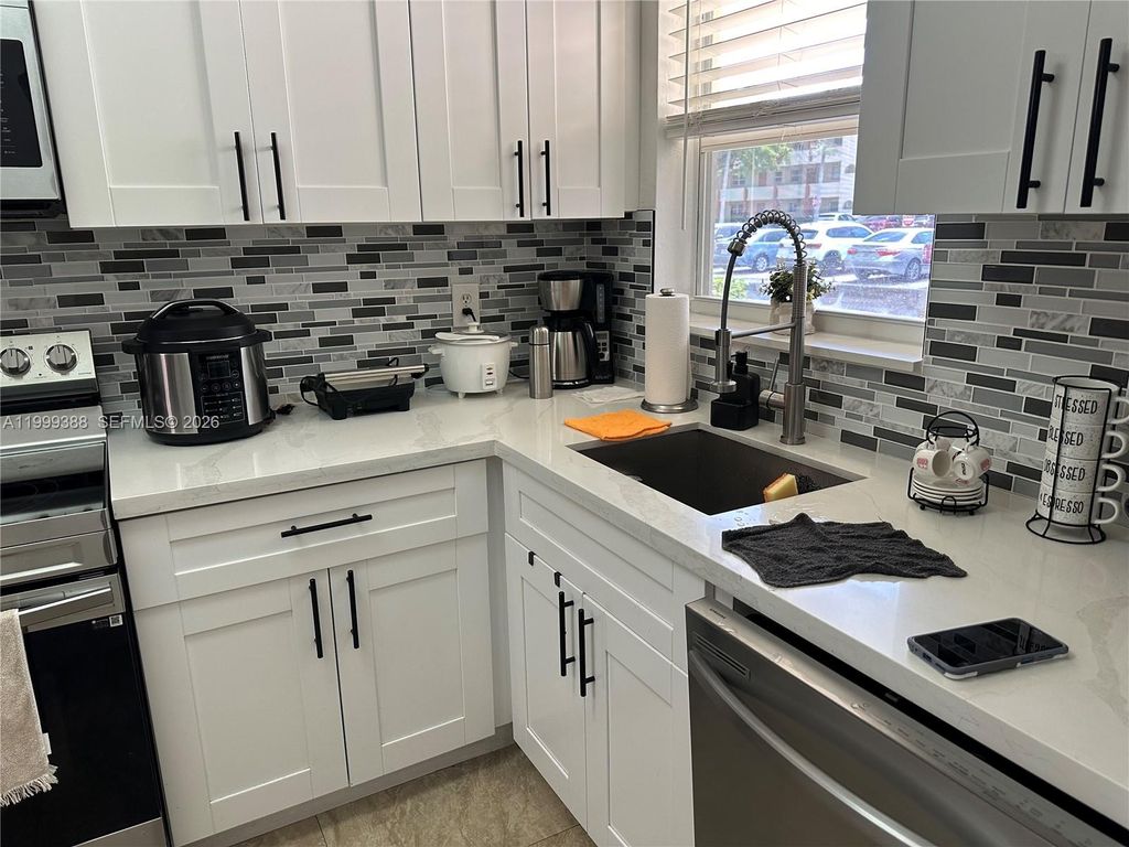 Photo of 8021 N Sunrise Lakes Dr #101, Sunrise, FL 33322 (MLS # A11999388)