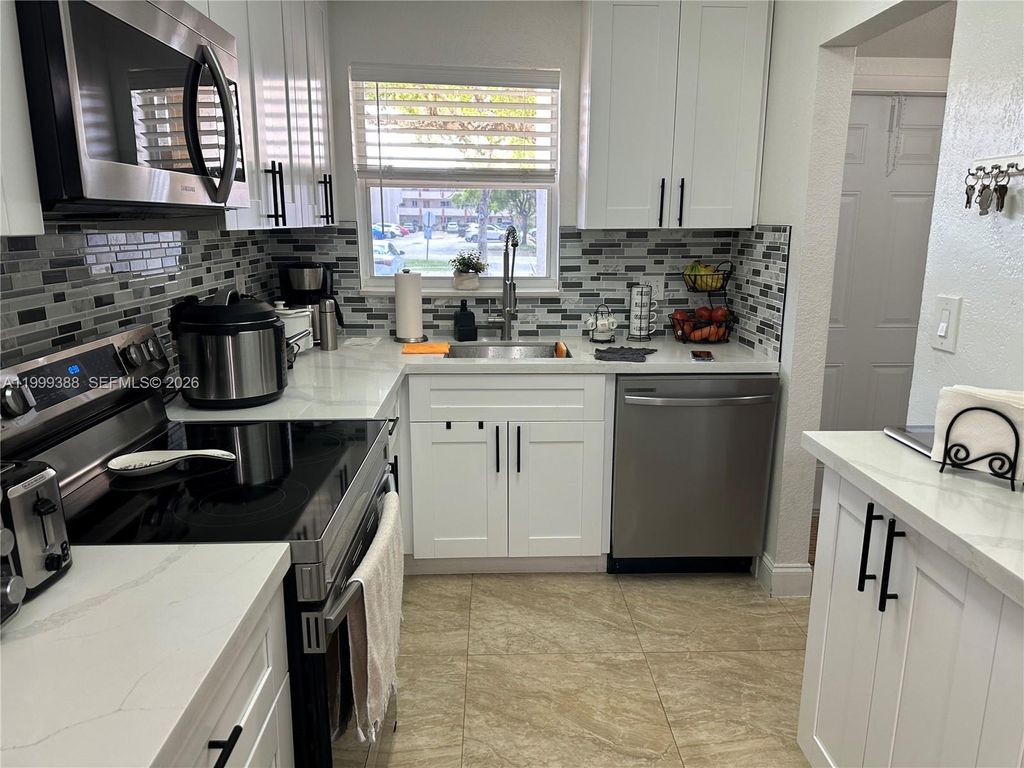 Photo of 8021 N Sunrise Lakes Dr #101, Sunrise, FL 33322 (MLS # A11999388)