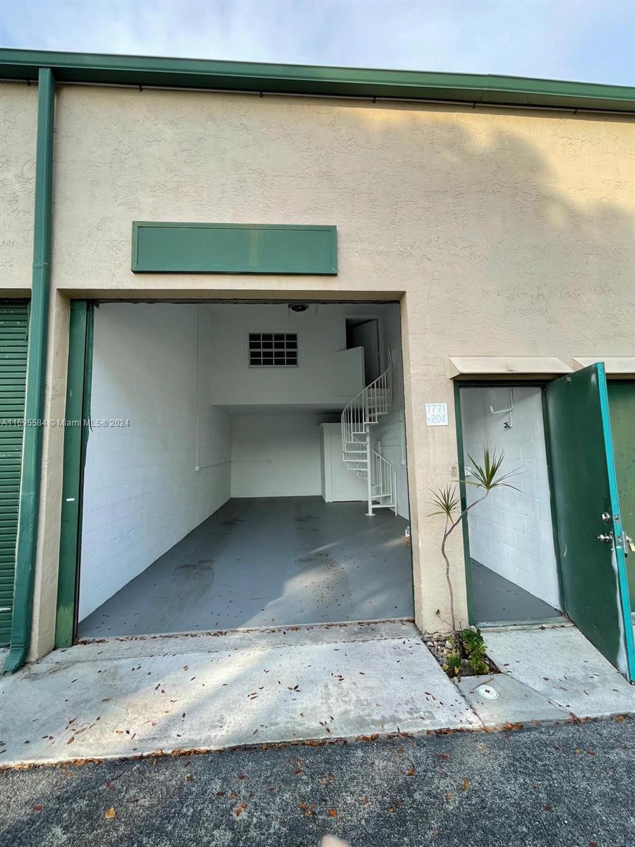 This Unit has a Mezzanine with A/C perfect for an office and warehouse space for storage on the ground floor. It includes water and sere. Tenant pays electricity and wifi if needed. Total square footage is aprx 622.50. 195 sq ft of office space on the Mezzanine and warehouse space is 427.50 with 17 feet clearance from ground to ceiling.