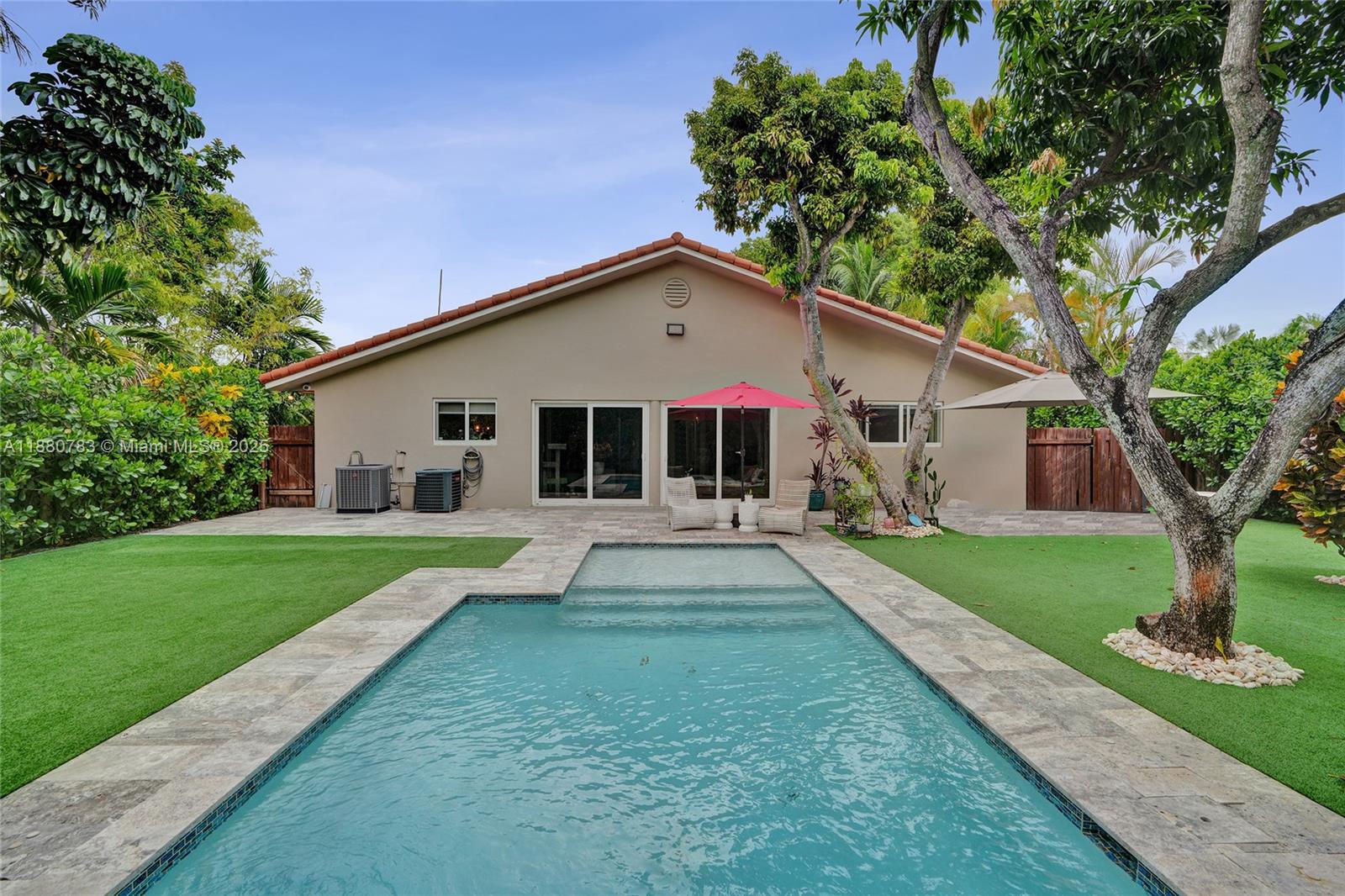 Step into this completely turnkey family home that seamlessly blends modern elegance with everyday comfort! Located in the prestigious neighborhood of “The Roads”, just minutes from Brickell & Key Biscayne beaches. This spacious home features an open layout kitchen with premium appliances & a large island that connects effortlessly to the living and dining areas. 3 large bedrooms, 2.5 bathrooms, + a versatile room office/studio complete with its own private entrance. Designer wallpaper and custom closets add stylish touches throughout! Step outside and relax by the pool & lounge area surrounded by lush landscaping and mature fruit trees. Recent upgrades include a new roof, brand-new heated pool, impact windows, redesigned garage, new AC, new driveway, electric gate, & renewed landscaping.