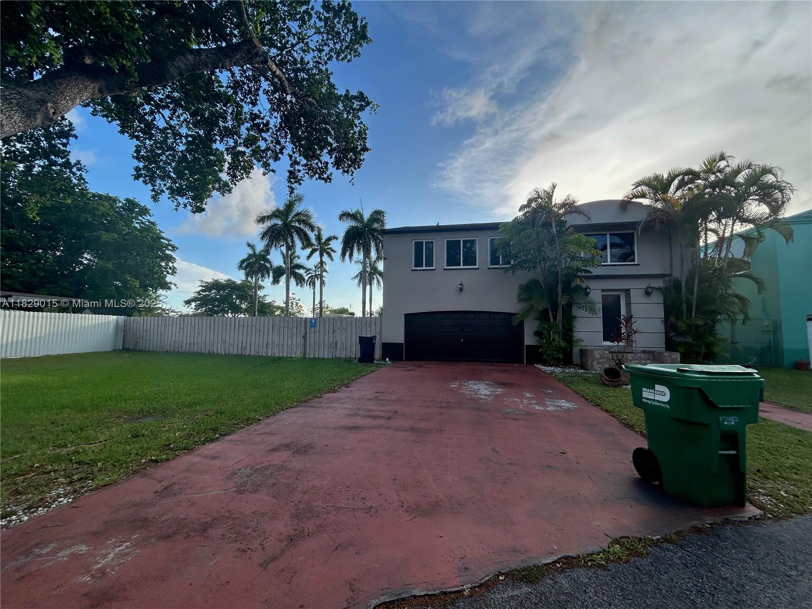 This beautiful home features 4 bedrooms, 2 bathrooms, and a 2-car garage. Situated in a secure guard-gated community, it offers a large yard, tile and laminate flooring, central A/C, and impact windows. A washer and dryer are included in the home. Tenant is responsible for all utilities.