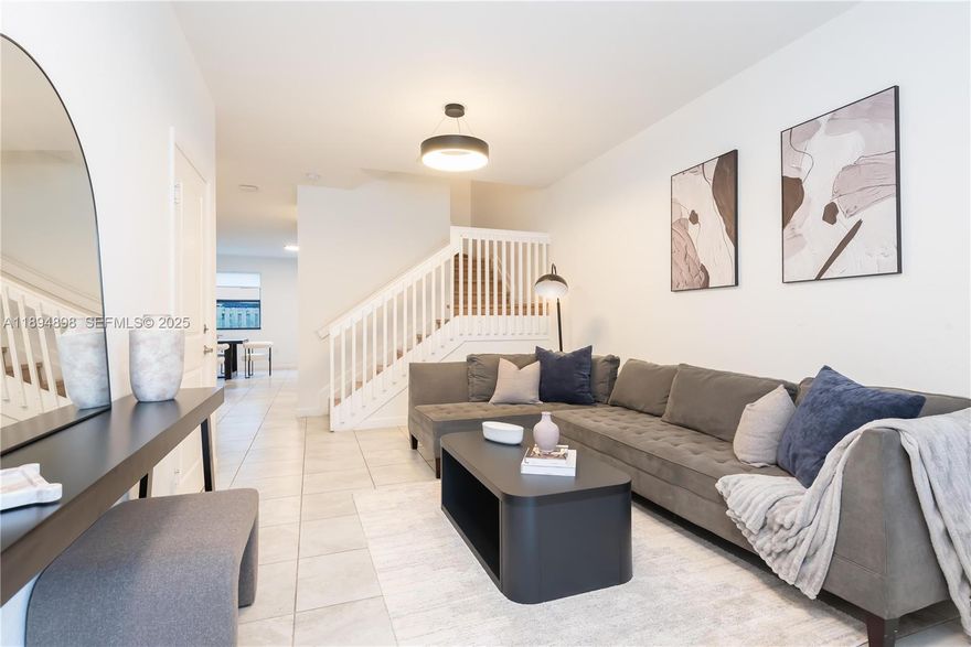 Seller is open to contributing towards buyer’s closing costs with a full price offer. Best price in the Isola Community! This spacious and modern smart home features laminated wood floors upstairs and ceramic tiles on the main level, combining style with low maintenance. The kitchen is equipped with stainless steel appliances and granite countertops. Sitting on a desirable corner lot directly facing the clubhouse and community pool, the property offers added privacy and comfort. Located in a gated community with low HOA fees, this home is located in the Homestead’s closest access point to the airport and major destinations. A perfect blend of value, convenience, and location.