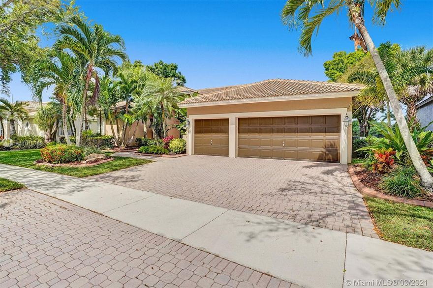 Tucked in the boutique gated community of The Landings. This custom home sits on an oversized long lake view lot  Oversized screened patio with electric awnings & stamped concrete pool deck 2006 with free form heated pool & spa. Plenty of room inside yard to put a children's play set or for the pets to run. Double split floor plan with oversized master bedroom - closet with new built-ins, sliders on pool & lake. The Master bath recently renovated 2010. Roman tub, shower, and dual sinks. Renovated kitchen 2011 with soft close wood cabinets, Stainless Steel appliances and granite countertops. Volume ceilings throughout. 3 car garage with a paver driveway. Walk to community park. Newer roof 2014. Accordion Shutters throughout.