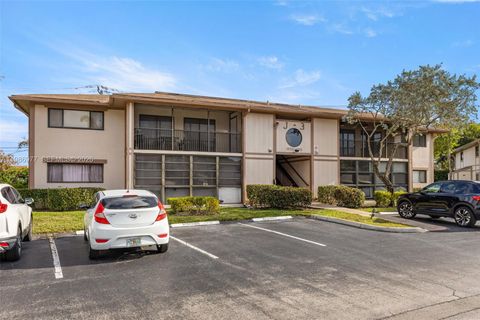 Photo of 10709 W Clairmont Cir #111, Tamarac, FL 33321 (MLS # A11986977)