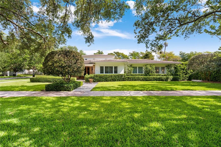 Experience timeless elegance on a quiet, tree-lined street in premier South Gables. This move in ready 4BD/3.5BA estate offers 3,685 SF of light-filled living on a lush 11,000 SF corner lot – built new or fully renovated in 2016 down to the bare blocks with all-new plumbing, electrical, HVAC, and roof.

A welcoming entry foyer with custom solid wood millwork sets the tone. The open great room flows seamlessly into a gourmet kitchen featuring custom cabinetry, white quartz countertops, and professional-grade appliances. Large-format porcelain tile, impact windows, and plantation shutters throughout.

Natural light fills every room. The thoughtfully designed split floor plan balances privacy with functionality. The serene primary suite downstairs impresses with pool views, a private office, spacious dressing room, and spa-style bath with frameless glass dual shower. Upstairs, two en-suite bedrooms and a flexible bedroom / den adapt to any need.

Outside, manicured tropical landscaping and privacy hedges frame a covered travertine terrace and pristine salt system pool — quintessential South Florida living from the moment you arrive.

Additional highlights: 2-car air-conditioned garage, whole-home generator, transfer switch, dual AC units, smart-home automation with cameras and lighting systems. Not in a flood zone. Minutes from top-rated schools, fine dining, and premier shopping. An exceptional opportunity rarely available at this address.