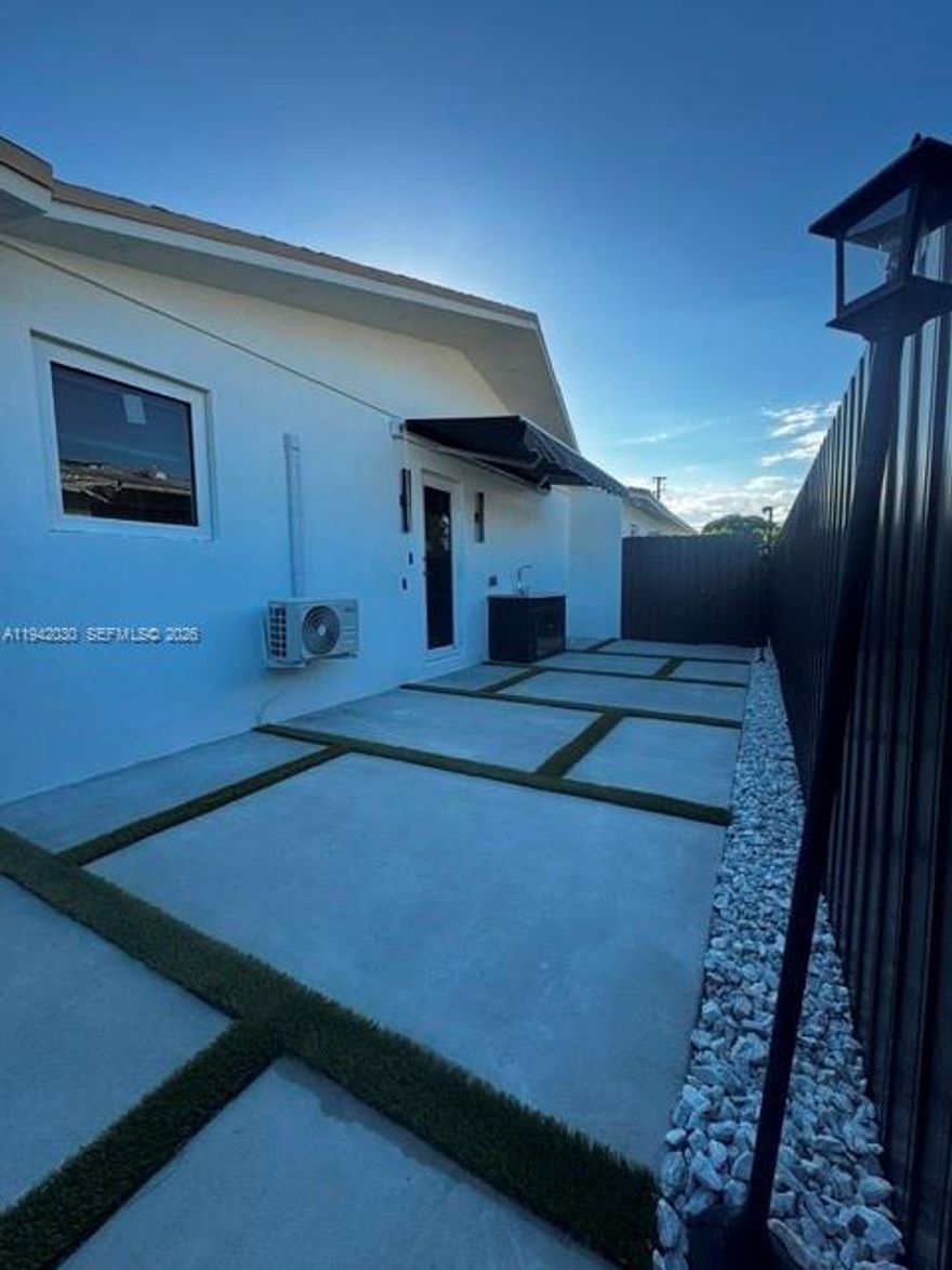 Apartment attached to the property featuring a spacious bedroom, bathroom, and kitchen. Includes in-unit washer and dryer, plus two parking spaces.