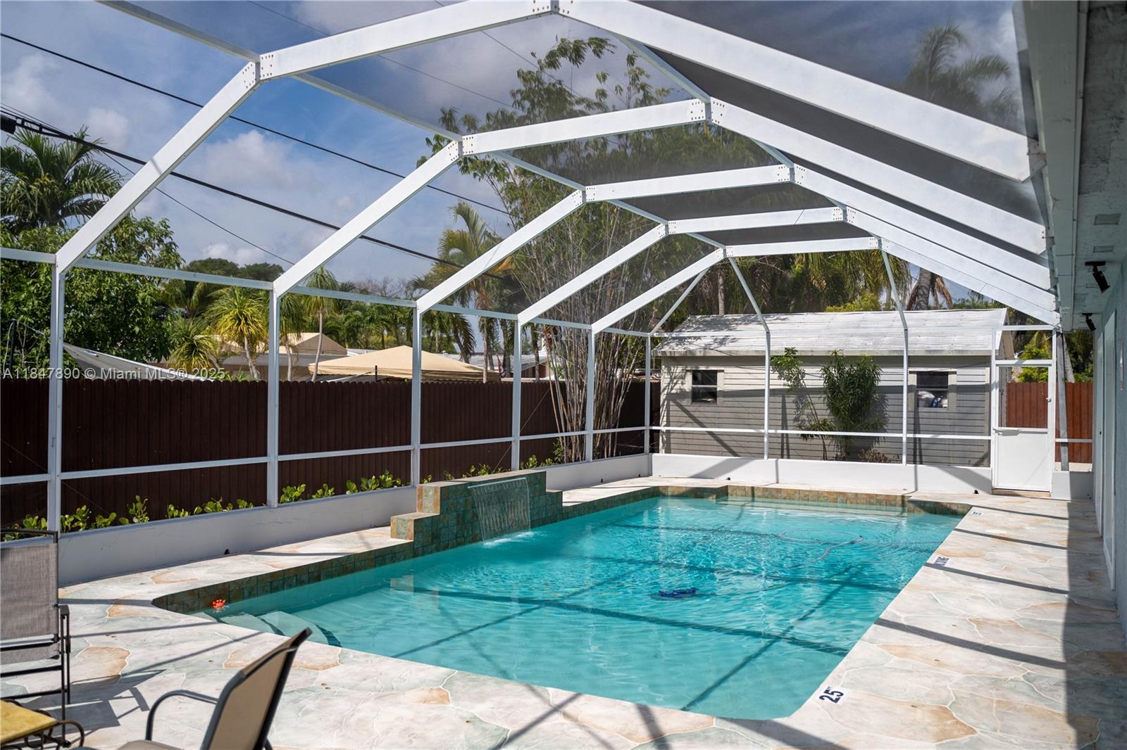 Cutler Bay Pool home. Over 2000 square feet featuring 4 generously sized bedrooms and 2 full bathrooms, split plan. Fully tiled. Partial impact windows and doors. Includes open floor plan, remodeled eat in kitchen with granite waterfall counter top and stainless steel appliances, large famiy room, dining area, living room and laundry. Property is fenced and child gate around pool. Large yard and ample parking space. Side area with concrete ready for small boat, RV, trailer. No Hoa. Close to Old Cutler Road. Minutes from Black Point Marina, local shops, schools, parks and restaurants. Golf cart town.