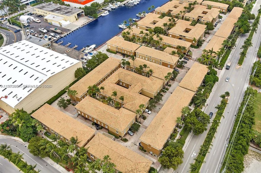 WATERFRONT CORNER UNIT WITH A BALCONY ONE OF A KIND IN COMMUNITY 3 STORY TOWNHOUSE 3 PARKING SPOTS , 2 CAR GARAGE , GREAT INVESTMENT WITH A TENANT INCLUDED ,TENANT PAYING $3400 , LONG TERM TENANT , PRICE TO SELL FAST