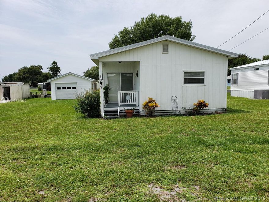 LAKE OKEECHOBEE ACCESS - BUCKHEAD RIDGE - 2/2 SWMH well maintained. Home comes fully furnished, turn key. A garage/workshop, carport, good access to lake. Seawall is in good shape and a dock to fish from.